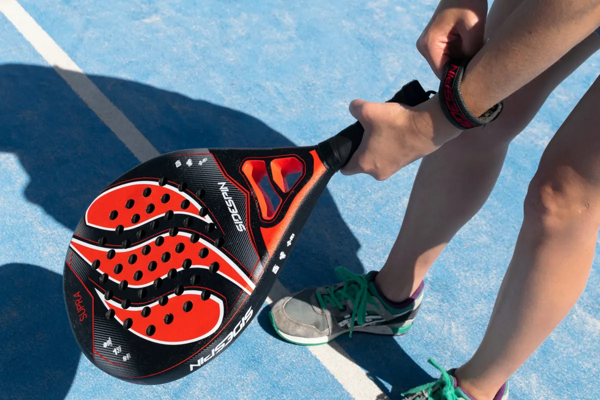 Padel racket on a blue court